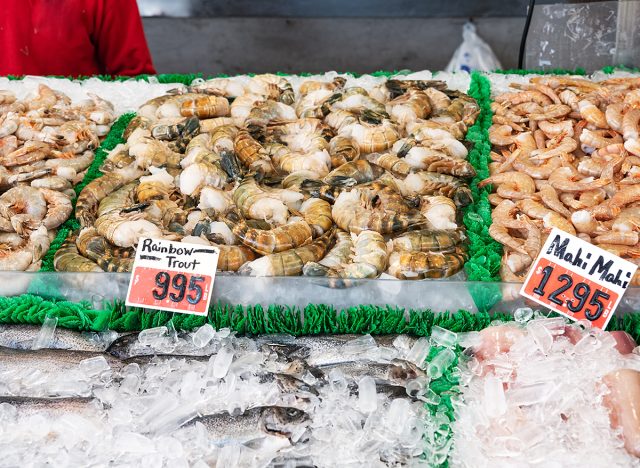 fish and seafood on the counter at the market