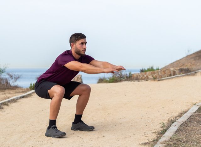man doing bodyweight squats