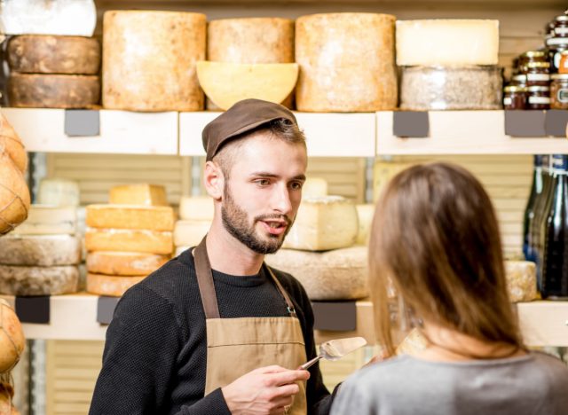 cheese salesperson talking to customer