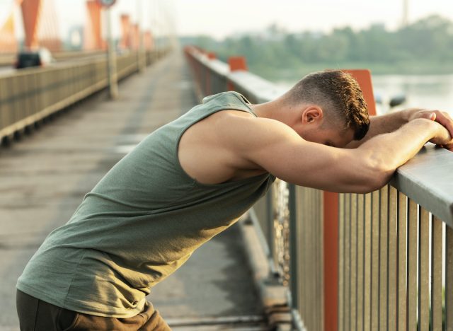 exhausted muscular man after run