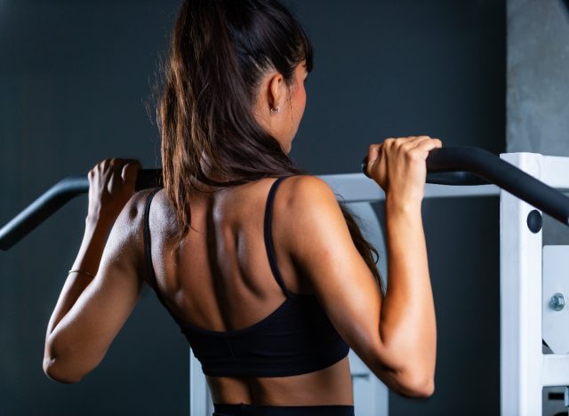 fit woman doing pull-ups