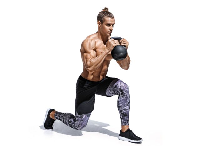 man doing kettlebell lunges