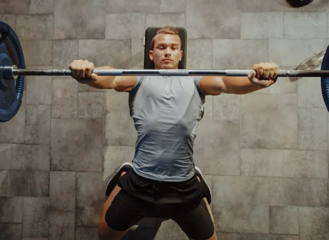 man doing barbell bench press exercise, concept of strength exercises for men