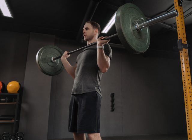 man doing military press exercise