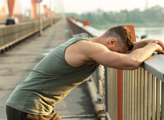 man tired after workout, overtraining concept