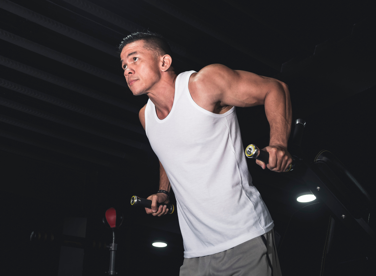 muscular man doing tricep dips at the gym, concept of bodyweight exercises for men to build strength