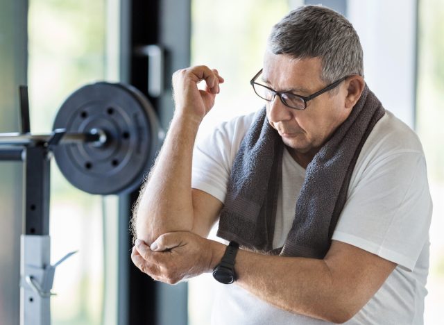 man with arm injury at the gym