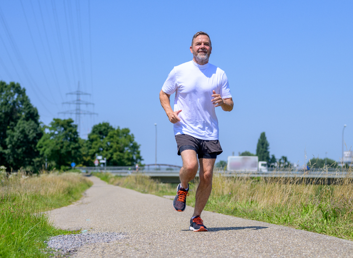 mature man running sprinting outdoors, concept of exercises to avoid after 50