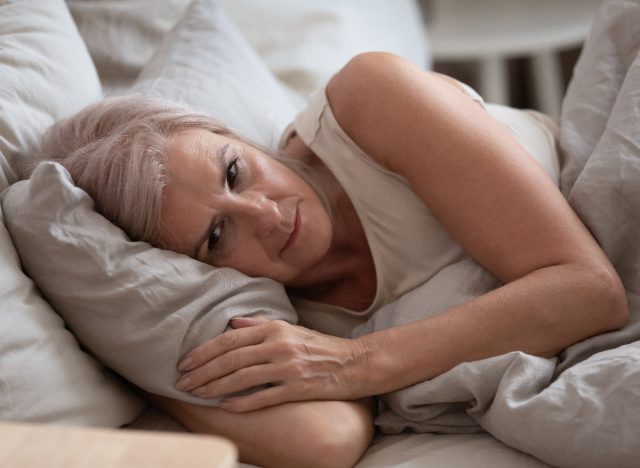 mature woman in bed
