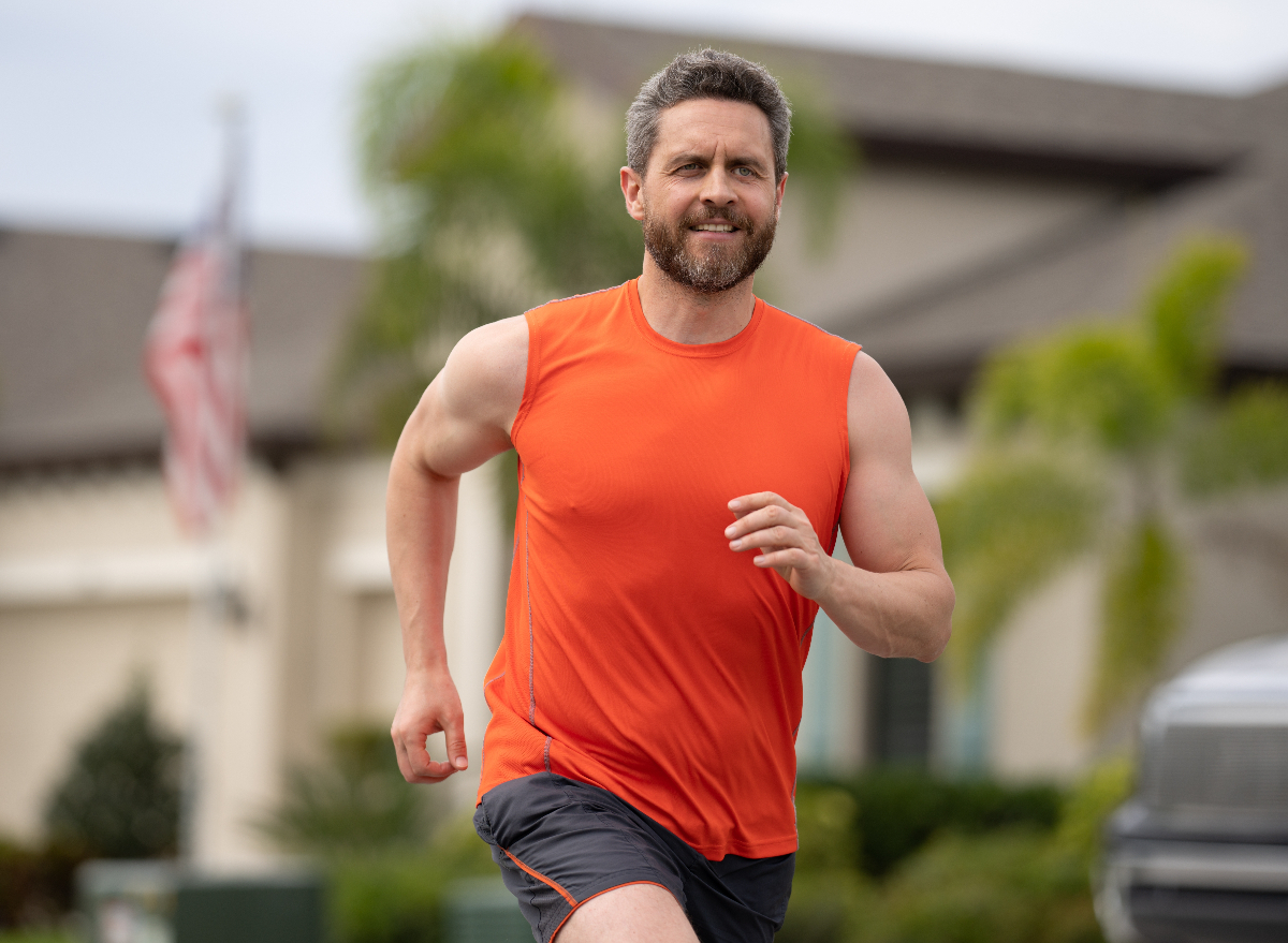 middle-aged man running, concept of an HIIT workout to lose 10 pounds in a month