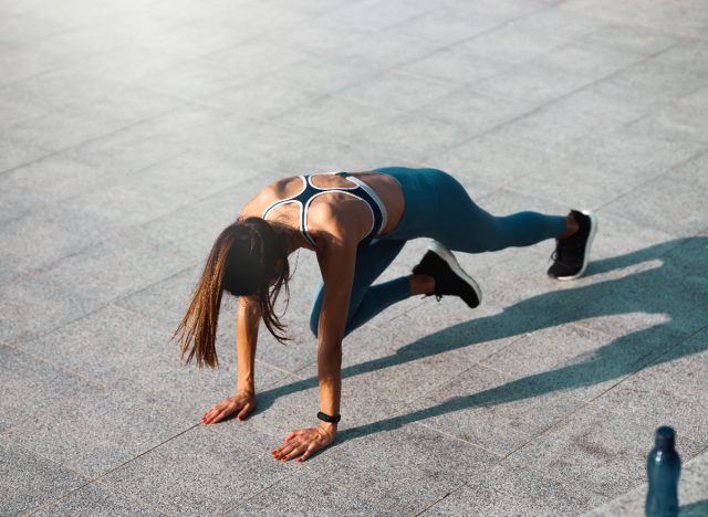 top view of woman doing mountain climbers