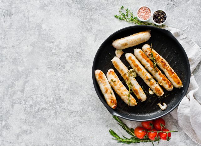 browned sausages in pan