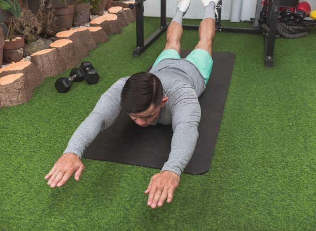 man doing superman exercise