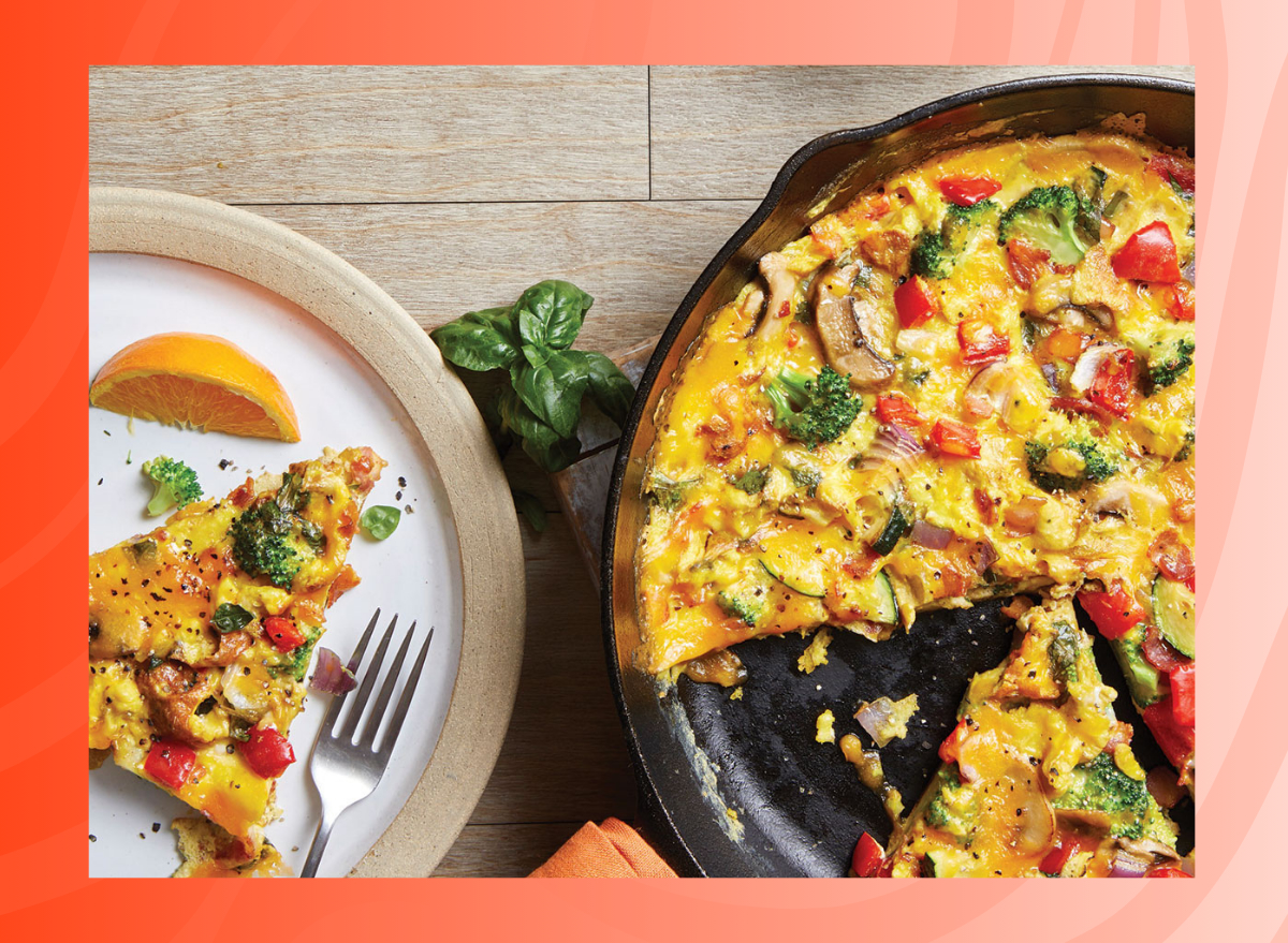 photo of vegetable frittata on red background