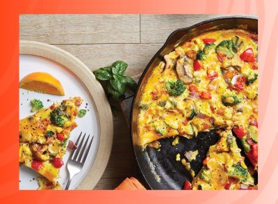 photo of vegetable frittata on red background
