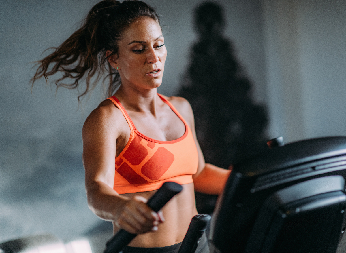 fit woman on the elliptical, concept of worst exercises for weight loss