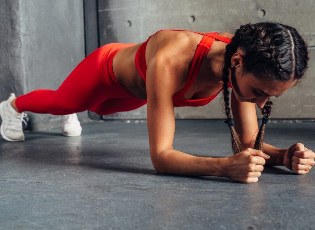 fitness woman doing forearm planks
