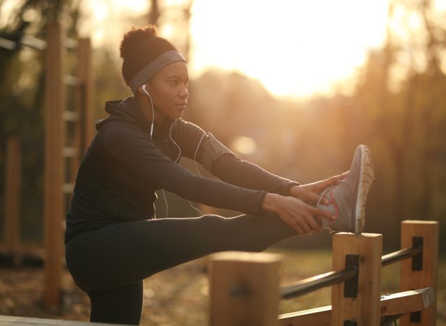 woman stretching outdoors