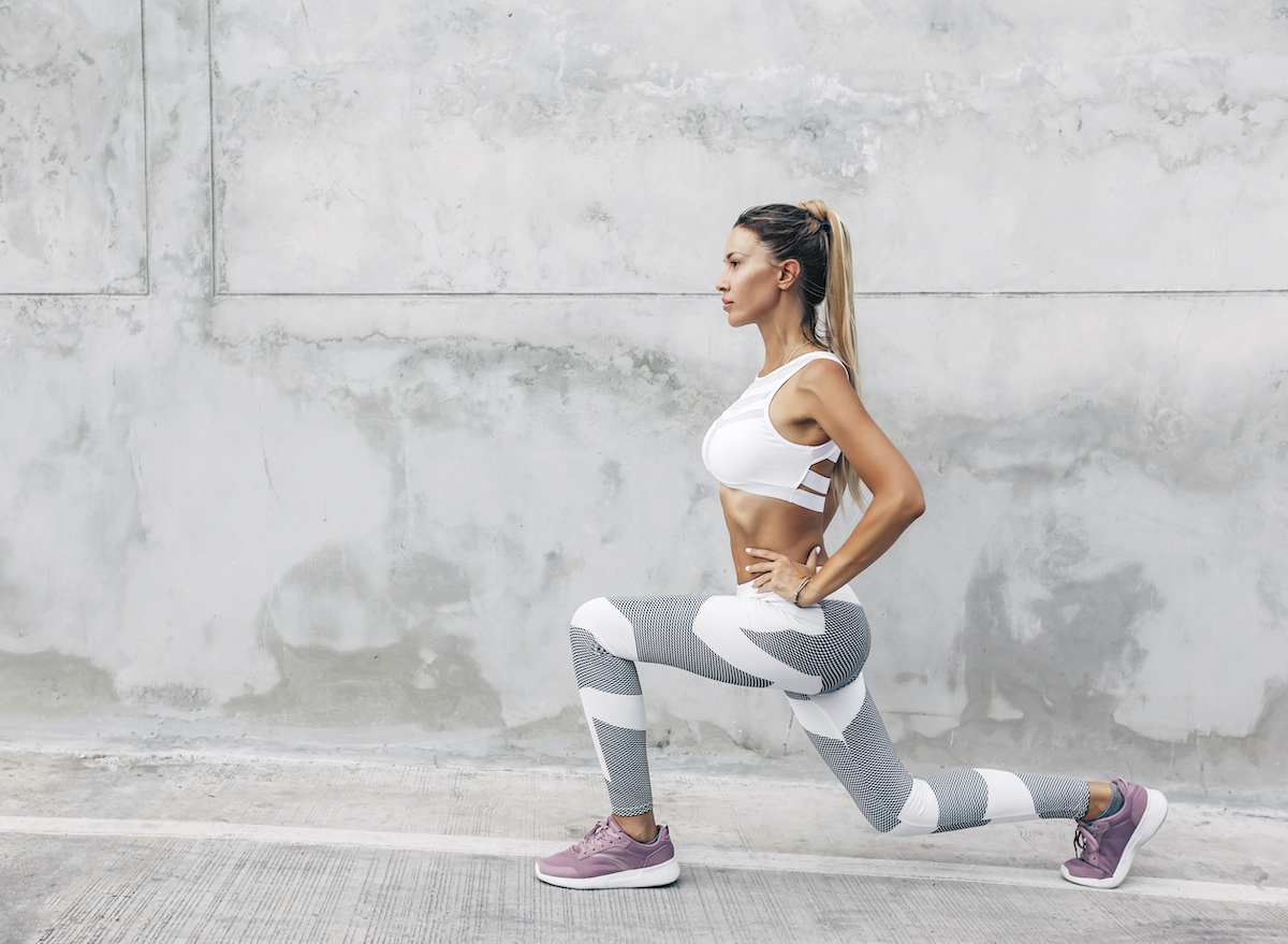 fit woman doing walking lunges, concept of strength exercises to keep your weight down for good