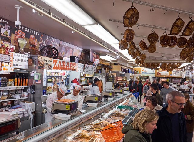 The fishmongers behind their desk at Zabar's speciality food store in NYC.