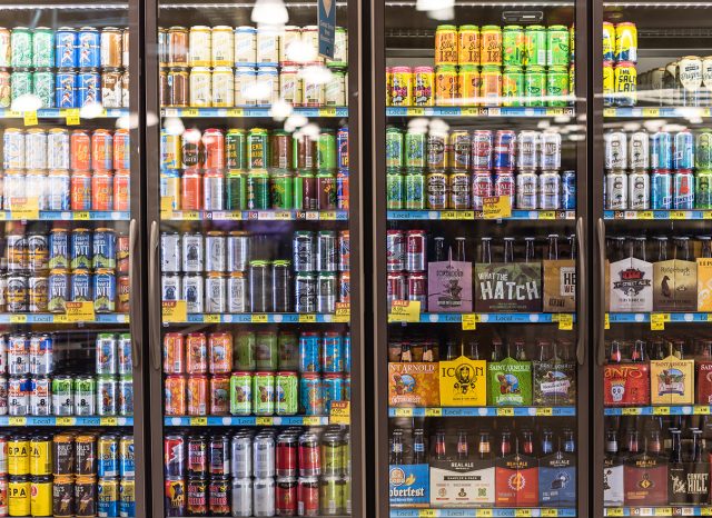Beers on shelf display in supermarket cooler
