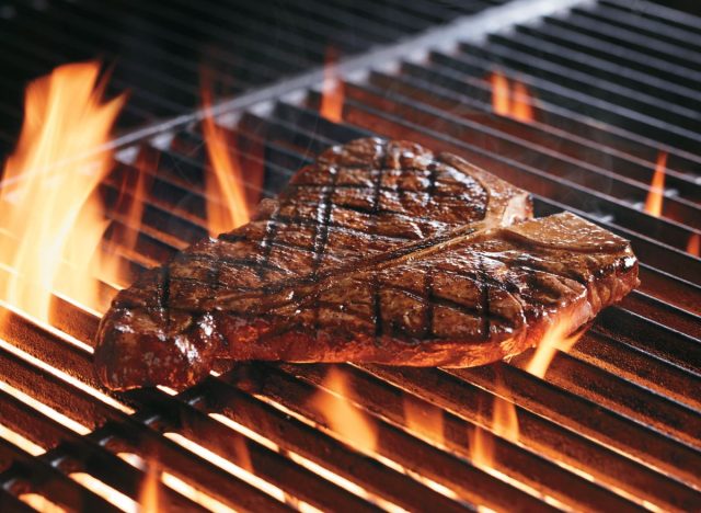 Porterhouse steak on the grill Courtesy of LongHorn Steakhouse  - 10 Unhealthy Menu Items at LongHorn Steakhouse