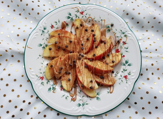 slice apple nachos with drizzle of nut butter