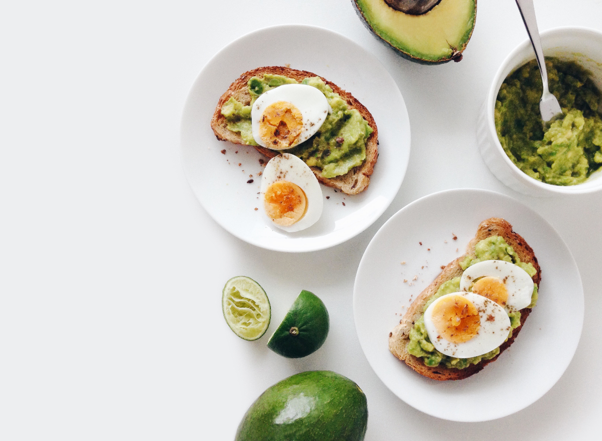 two plates of avocado toast, concept of healthy snacks for belly fat loss