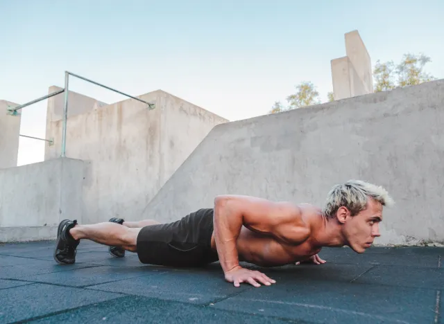 fit man doing burpees