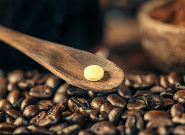 caffeine pill and coffee beans