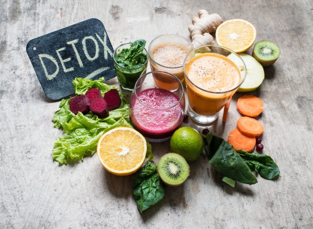 juice detox, juices next to fruit and veggies, concept of wellness trends that destroy your body