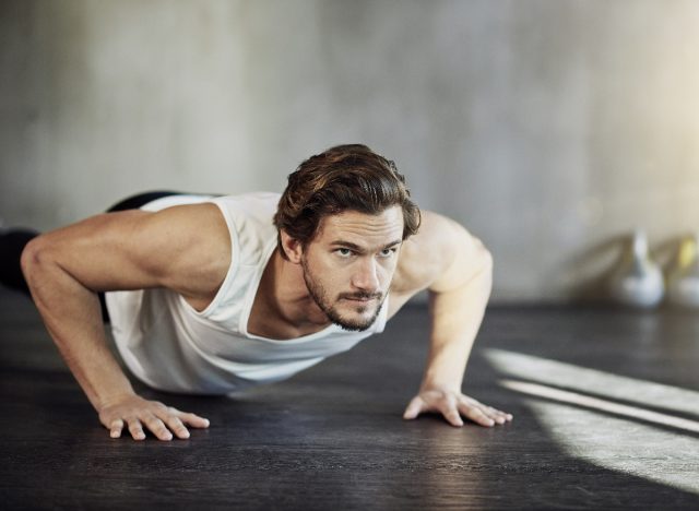 fit man doing pushups, concept of floor exercises for men