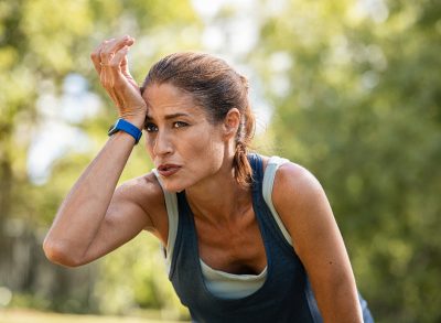 fitness woman exhausted during workout, concept of bad fitness habits to quit after 40
