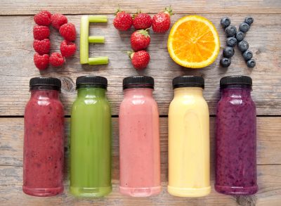 juice detox, juice bottles, concept of wellness trends that destroy your body