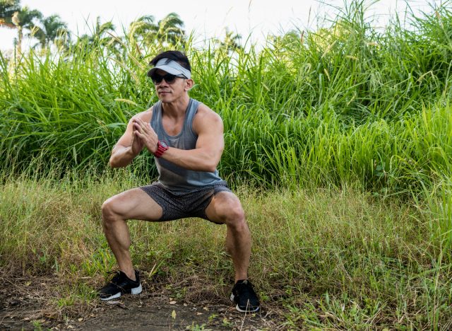 fit man doing jump squats, concept of bodyweight exercise mistakes