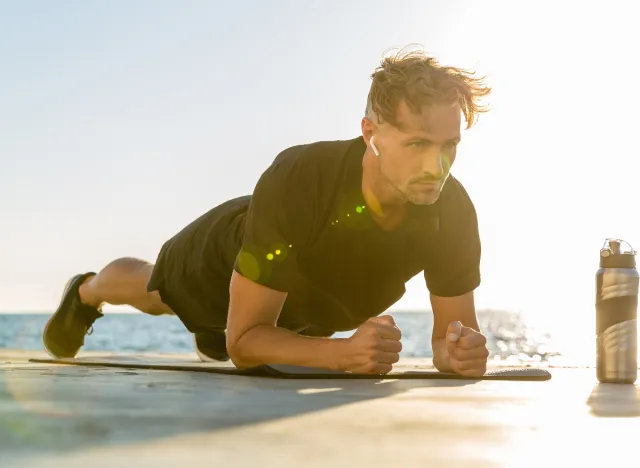 fit middle-aged man doing planks