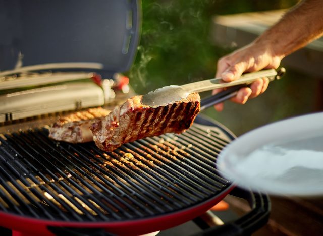 man grilling perfect steak