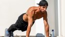 fit muscular man doing pushups, high plank position, concept of daily floor exercises for men to stay fit