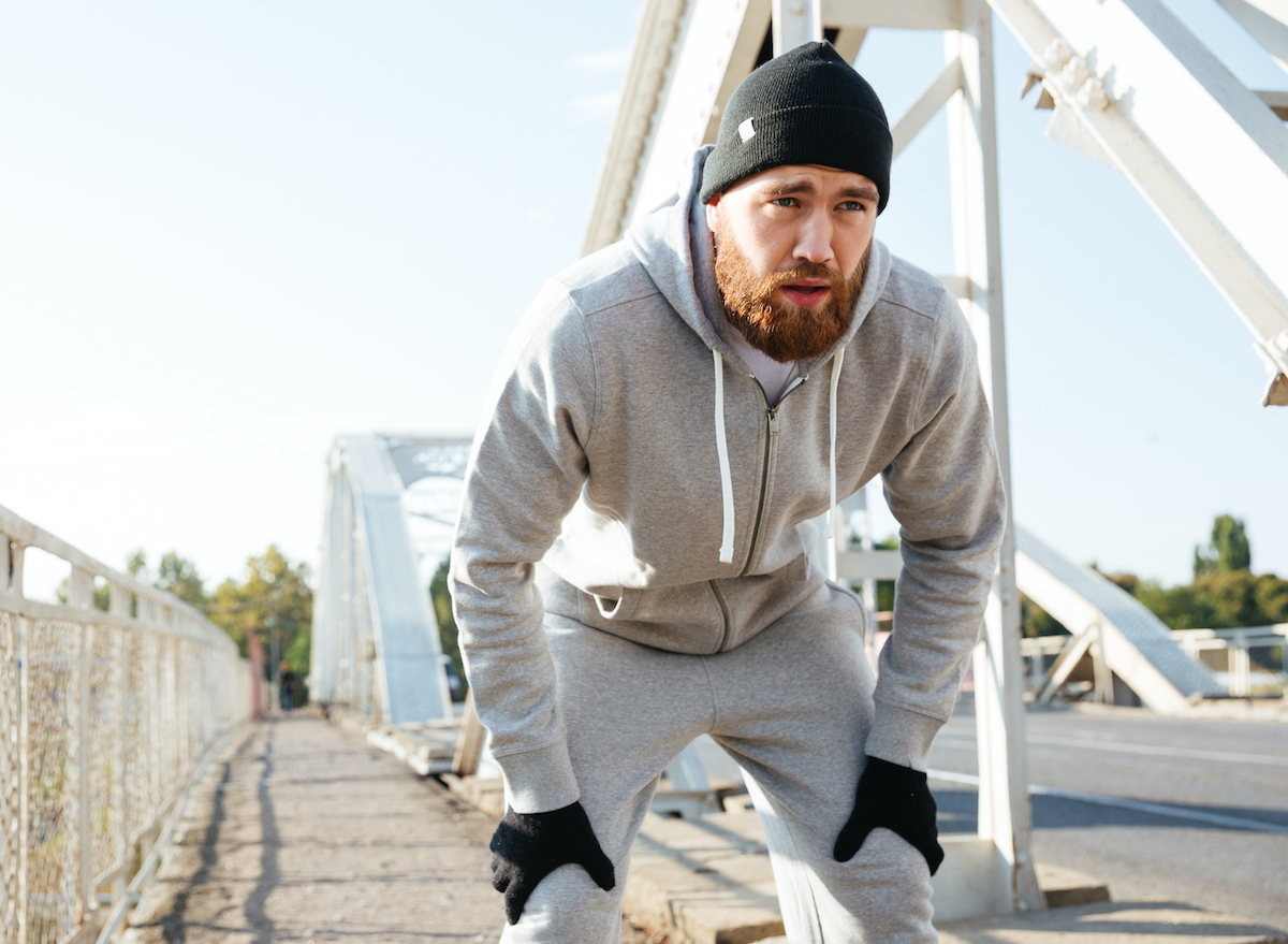 man tired, taking a break from his run, concept of habits that destroy workout