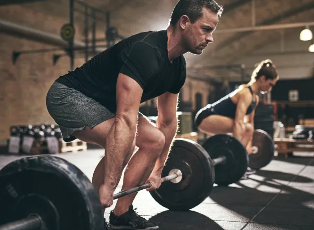 middle-aged man doing deadlifts