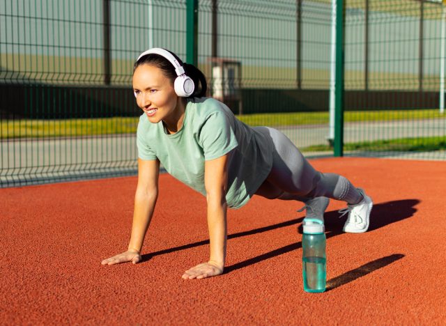 middle-aged woman doing pushups