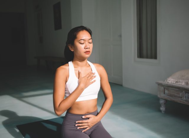 woman practicing mindful breathing