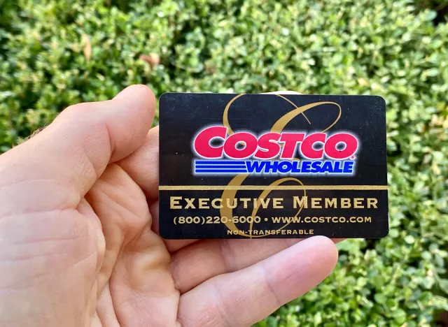 person holding costco executive membership card