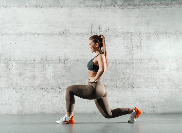 woman doing walking or forward lunges