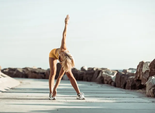 fit woman warming up for exercise