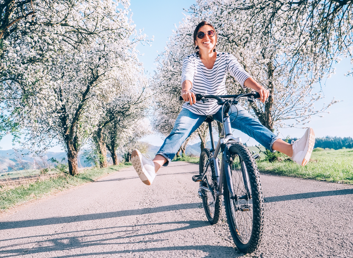 happy woman riding a bike