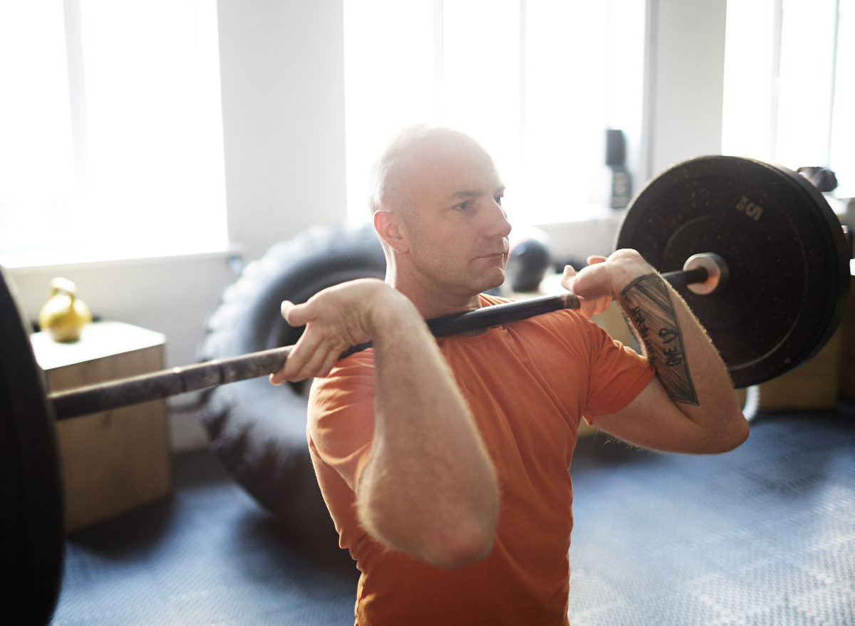middle-aged man lifting weights, concept of strength-building exercises for men over 40