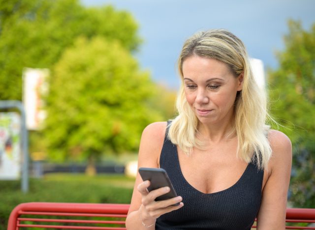 middle-aged woman texting