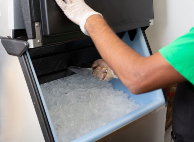 starbucks employee scooping ice