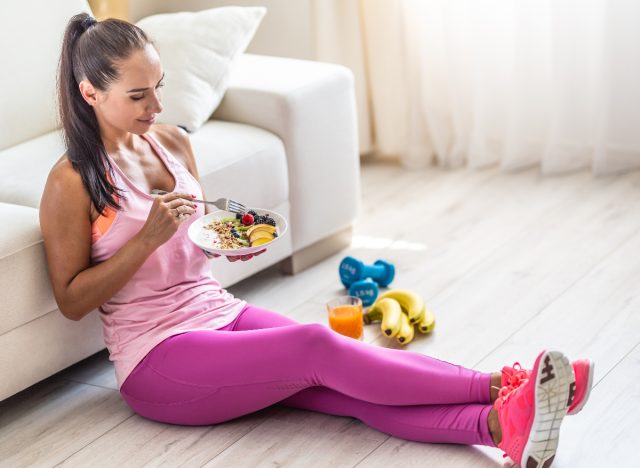 fitness woman eating yogurt bowl